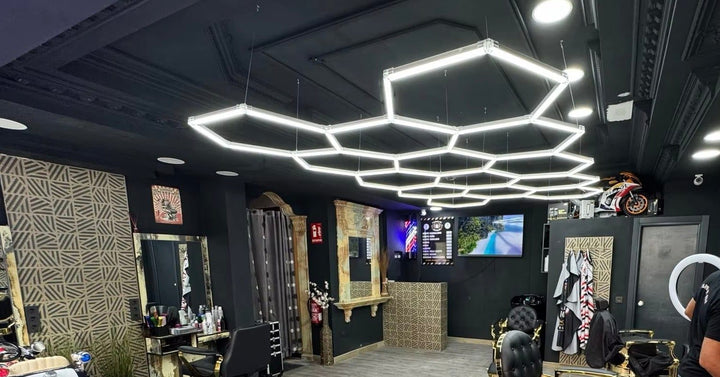 Hexagon light grid above the cutting stations in a barbershop