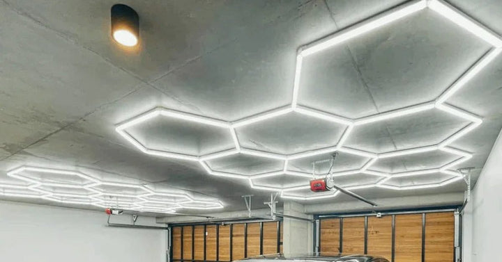 Hexagon light grid on a white garage ceiling near timber garage doors