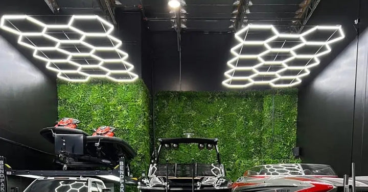 Two hexagon light grids lighting a shed with a green feature wall