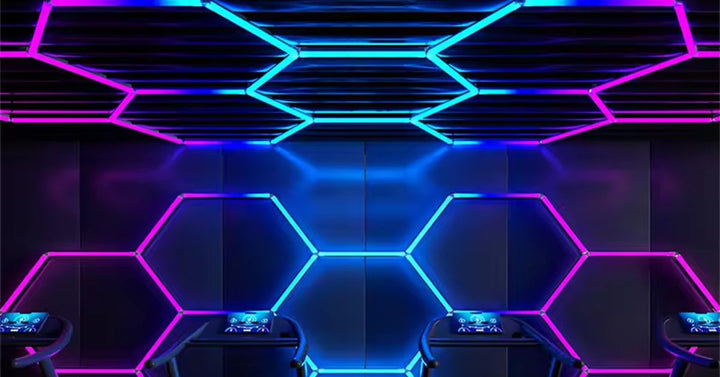 RGB hexagon lights glowing pink and blue across a ceiling and wall