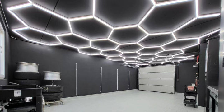 HexSpace hexagon LED lighting grid glowing across a dark shed ceiling