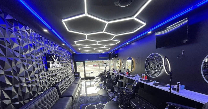 Hexagon light grid with blue accent lighting in a barbershop