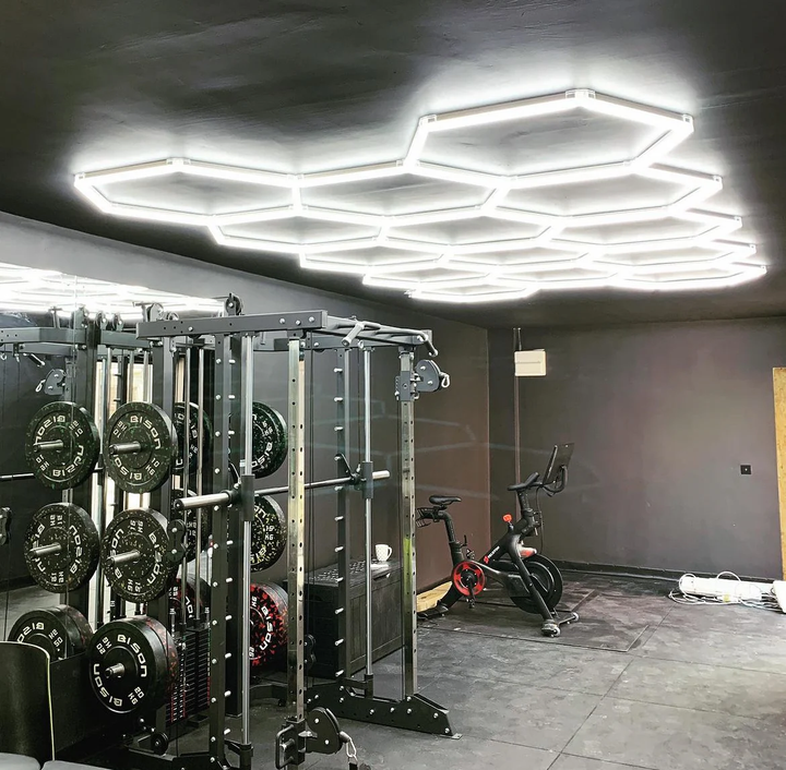 14 hexagon lighting on black ceiling of gym