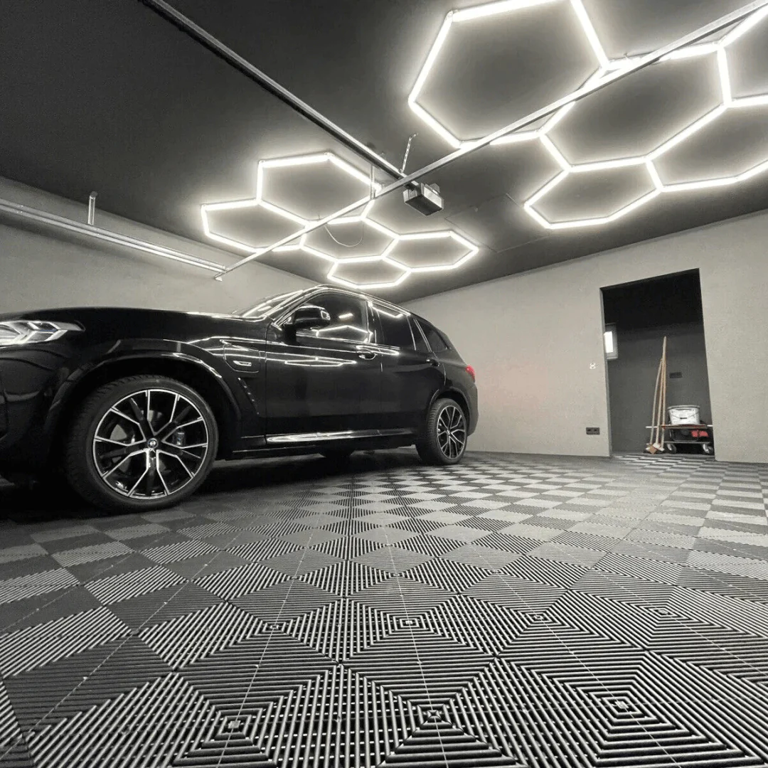 2 set of 5 hexagonal shape lighting on black ceiling of home garage 