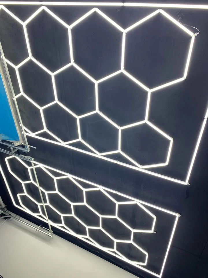 2 set of hexagon shape lighting system on black ceiling