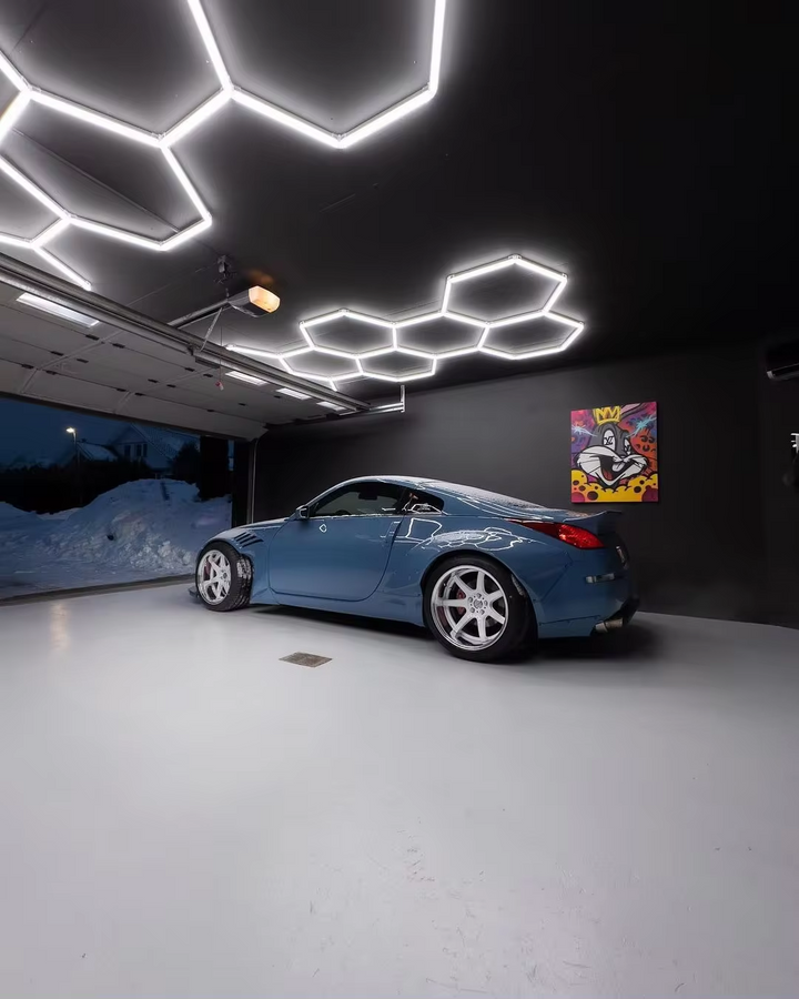 long 8 hexagon lighting led systems in black ceiling of black garage 